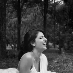 A candid black and white photo of me laughing freely in nature. This is me in my element, full of joy and light. It's a reminder to embrace the simple, happy moments.