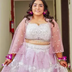 This bride is glowing and ready for her Haldi ceremony. The makeup enhances her natural radiance with a dewy finish and a soft, pretty lip color.