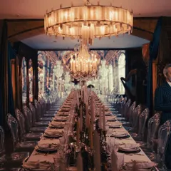 A breathtaking view of our tablescape for an event inspired by the Château de Versailles' Hall of Mirrors. The endless table, dramatic chandeliers, and warm candlelight created an opulent and truly immersive dining atmosphere.