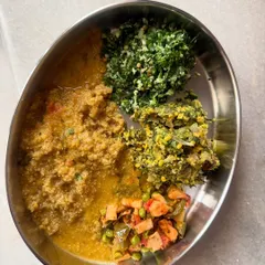 This plate features a fresh raw methi salad, dill dal saaru, and quinoa, showcasing how I incorporate fresh greens and diverse grains into daily meals.