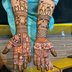 A creative baby shower design with "Mom" and "Dad" written on the arms, along with cute baby clothes, a stroller, and alphabet blocks on the palms.