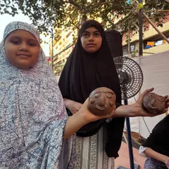 Two participants from the Govandi Arts Festival showing the expressive clay faces they made. Art has a way of connecting us all, and I am so grateful for these moments.