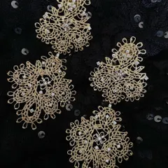 A pair of limited edition danglers crafted to be a "light delight". The intricate, lace like gold work is sprinkled with diamonds, making them a perfect addition for your festive wardrobe.