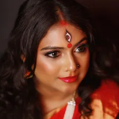 I love getting creative for themed photoshoots. For this Navratri-inspired Devi look, we focused on powerful, expressive eyes and artistic details like the hand-painted third eye, creating a truly memorable and divine portrait.