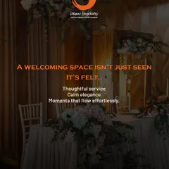 A welcoming space is not just seen, it's felt. This image captures the essence of our hospitality with an elegantly set table adorned with flowers, promising thoughtful service and moments that flow effortlessly.