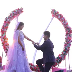 A dreamy beachside ring ceremony, with the groom proposing against a beautiful floral arch. We capture proposals in the most picturesque settings.