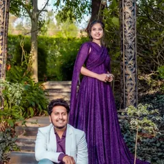 A romantic shot of the couple. The groom's outfit is simple yet stylish, complementing the bride's grand gown.