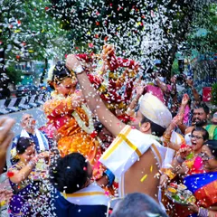 There's nothing like the pure joy of a wedding celebration. I love capturing these candid moments, like this traditional flower shower during a Muhurtam ceremony. It’s all about real emotions and vibrant colors.