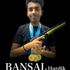 Meet Hardik Bansal, one of my top shooters, showcasing his medals and his competition air pistol. This portrait captures the confidence and pride that comes from countless hours of dedicated practice and winning results.
