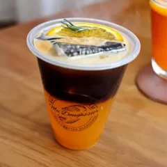For a refreshing twist on your coffee, try my Orange Americano. It's a vibrant combination of a bold espresso shot poured over chilled orange juice, garnished with a slice of orange and a sprig of rosemary.