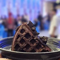 A rich and indulgent chocolate waffle slice, topped with chocolate chunks. A must-try for all chocolate lovers.
