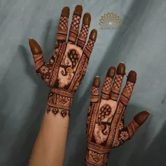 A classic Indian design featuring majestic peacocks. The intricate feather details and checkerboard patterns create a full and traditional look.