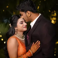 A tender moment between the couple during their Sangeet night. Her makeup is designed to look beautiful even in close-up shots.