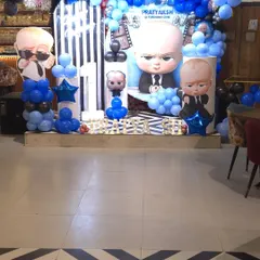 This is how I bring popular themes to life. Here's a look at a 'Boss Baby' first birthday party setup at my Noida Sector 63 hall, featuring a custom backdrop, character cutouts, and a blue and black balloon arrangement to create the perfect photo zone.
