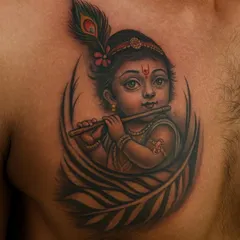 This chest tattoo of Bal Krishna (baby Krishna) is a symbol of divine innocence and love. I used soft shading to create a realistic and gentle portrait, focusing on his playful eyes and the delicate peacock feather in his hair. It’s a piece that sits right over the heart.