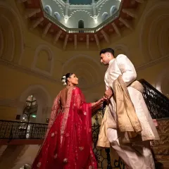 A moment of quiet grandeur. I love using dramatic architecture to frame a couple's story, making their portrait feel as epic as their love is. This is a classic editorial shot from a Mumbai wedding.