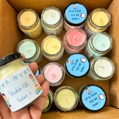 A top-down view of the birthday candles, showing the different pastel colors of the wax. These are a great budget-friendly option to add to a return gift hamper.
