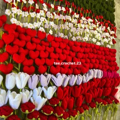 Another angle of the flower wall, highlighting the variety of tulips, hearts, and daisies ready for bouquet making.