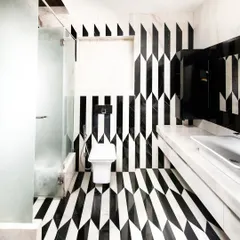 We believe in the power of detail. This bathroom, with its bold marble inlay work, shows our commitment to craftsmanship and creating moments of unexpected beauty. It’s an example of how even the most functional spaces can be transformed into art through thoughtful material selection and execution.