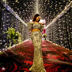 Shining bright under a tunnel of fairy lights in Ludhiana. This glamorous silver and white lehenga was perfect for a big fat Punjabi wedding reception.