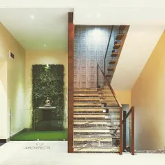 We bring nature indoors to create moments of peace and beauty. This vertical garden, installed as a feature wall by the staircase, acts as a living piece of art, improving air quality and adding a vibrant, natural texture to the home's interior design.
