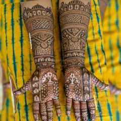 A royal Rajasthani story in henna. This design is filled with palace architecture, graceful peacocks, and elephants, creating a majestic look perfect for a bride.