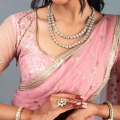 Our client felt like a princess in this custom pink brocade lehenga. The set includes a beautifully detailed blouse with unique sleeve work and a lightweight net dupatta, creating a look of pure elegance.