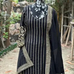 The kurta features beautiful handwork on the sleeves and border, while the sharara pants have vertical lines of gotta patti.