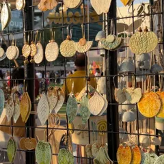 A display of my leaf-shaped earrings at The Lil Flea. I use real leaves to create the impressions, so each pair captures the unique details of nature.