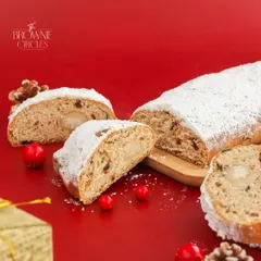 Our Christmas Stollen Bread is a festive German classic. This fruit-filled loaf is enriched with spices and marzipan, then dusted with powdered sugar for a snowy finish.