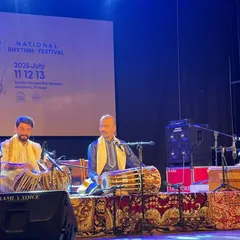 In a high-energy 'Jugalbandi' or percussion duet with the talented Sukhad Munde on Pakhawaj at the National Rhythm Festival in Kerala. These rhythmic dialogues are always a thrill.