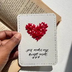 "You make my heart smile." A simple and sweet message on a card with a hand-stitched red heart. Sometimes, less is more.