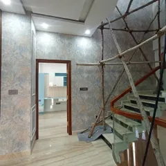 A textured wallpaper in a hallway, showing the installation in progress with scaffolding for the staircase.