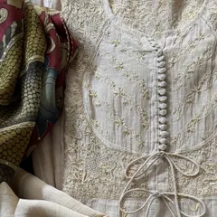 This image highlights the delicate Chikankari embroidery on the tissue chanderi fabric, enhanced with shimmering sequins and Kasab work for a touch of refined glamour.