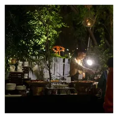 An atmospheric shot of our buffet station at night. The focused lighting on the station and the chef at work highlights the dedication and professionalism of our team, even in low light conditions.