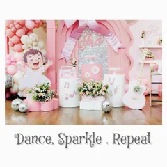 'Dance. Sparkle. Repeat.' This image captures the essence of our dance-themed party, with a full view of the pink, music-inspired setup.