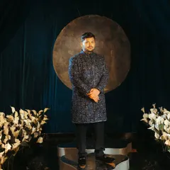 Groom styling is just as important to tell a complete story. For Abhishek's sangeet, we chose this impeccably embroidered navy blue Manish Malhotra ensemble that was refined, stylish, and perfectly complemented the bride's look.