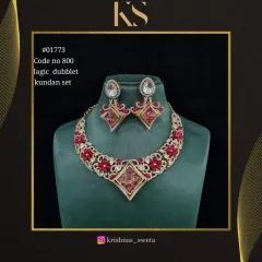 An exclusive Kundan set with a magic doublet stone that changes color in the light. This red version is bold and beautiful.