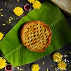A full view of my Egg Roast Puff Pie, created for my Onam menu. The intricate lattice top is made from my homemade puff pastry, and it's filled with a traditional egg roast masala.