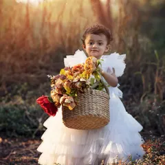 This little lady with her basket of flowers is just the sweetest thing. Outdoor photoshoots allow kids to be themselves and explore, resulting in beautiful, natural portraits filled with personality.