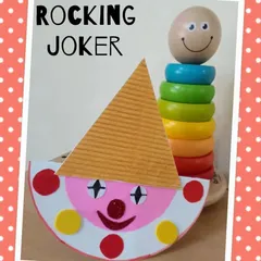 A colorful rocking joker made from paper plates and other simple craft materials. This activity combines painting, cutting, and assembling to create a fun, interactive toy.