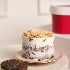 A close-up of our Mint Oreo ice cream cake, revealing chunks of cookies swirled into creamy mint ice cream. It’s a cool, classic combination that never disappoints.