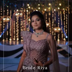 A portrait of the bride showcasing her full sangeet glam look, from the bold eye makeup to the statement diamond necklace.
