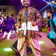 Hosting large-scale public festivals like Navratri is my passion. Here I am at Raasleela Mumbai, dressed in traditional attire, connecting with thousands of people through music, dance, and pure festive energy.