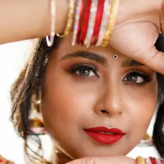 An intense and captivating close-up. This shot focuses on the dramatic eye makeup and the model's direct gaze, showing how makeup can be used to create a powerful mood.