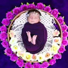 This overhead shot shows a newborn peacefully sleeping in a basket, encircled by beautiful purple and white roses. We use floral arrangements to add a touch of natural beauty.