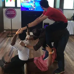 While a VR dance simulation plays on screen, employees engage in a fun physical team-building activity. My events are designed to bring people together, both in and out of the headset.