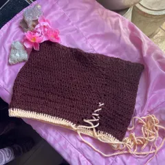 Another look at the brown crochet skirt, styled on a pink background to show the color contrast. Every skirt is made to order, so you can request any color combination you can think of.
