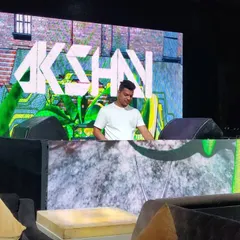 Your event gets my full brand of energy, right down to the visuals. I project my custom logo and graphics on the main screens, creating a professional and high-impact atmosphere. This setup shows how I can transform any venue into a top-tier party zone.