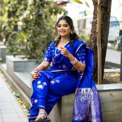 A Nauvari drape doesn't have to be just for weddings. For her engagement, we chose this stunning royal blue Nauvari, draped for comfort and style. This shows how a traditional outfit can be perfect for any celebration, making you feel like a modern warrior princess.
